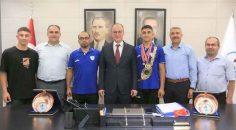 BAŞKAN ÖRKİ, ŞAMPİYON GÜREŞÇİYİ AĞIRLADI